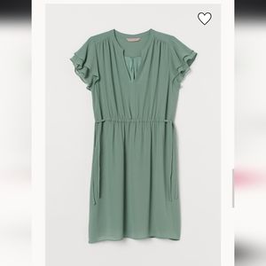 Green ruffle shoulder dress